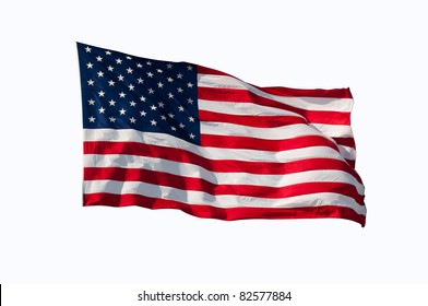 American flag flying in the wind, isolated on white.