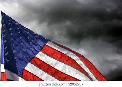 American Flag Flys Against Storm Clouds