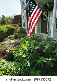 American Flag In The Front Yard Garden.