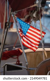 American Flag Hanging Down From A Boat.