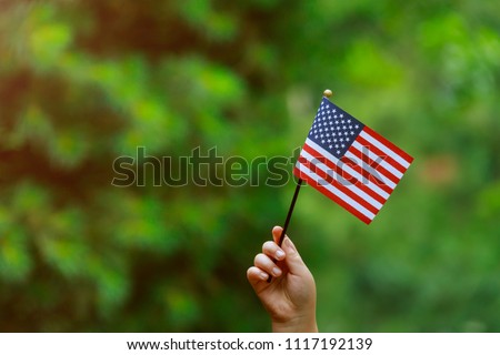 with american flag in her hand Independence Day, Flag Day concept