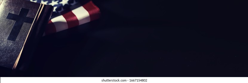 American flag and holy bible book on mirror background. Symbol of the United States and religion. Bible and striped flag on a black background. - Powered by Shutterstock