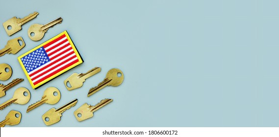 American Flag And Keys On A Gray Background. VA Mortgage Or Department Of Veterans Affairs Home Loan.