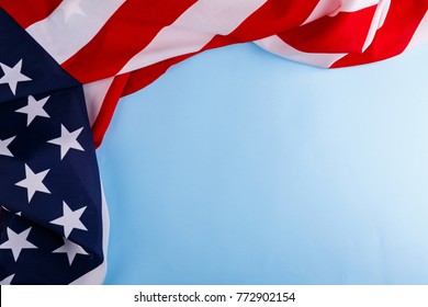 The American flag lies on the perimeter of the left and upper sides on a blue background