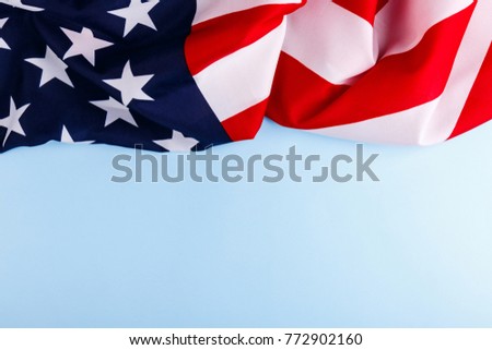 American flag lies on top of a blue background