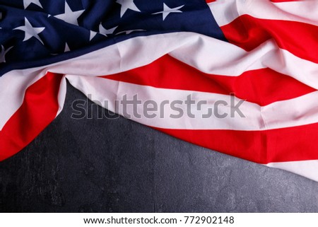 The American flag lies at the top on a gray background
