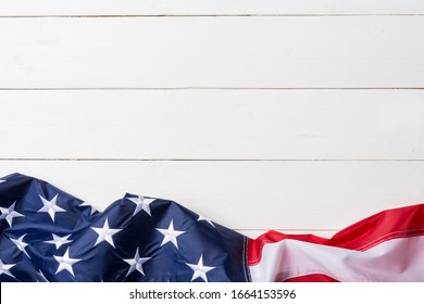 American flag lying on old white wooden background - Powered by Shutterstock