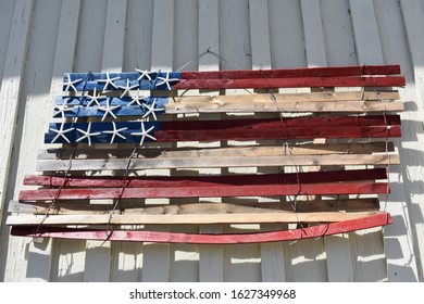 American Flag Made From Driftwood Hanging In Coastal Small Town America