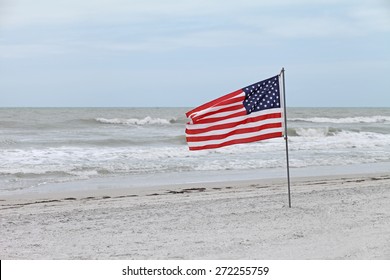 American Flag On Beach