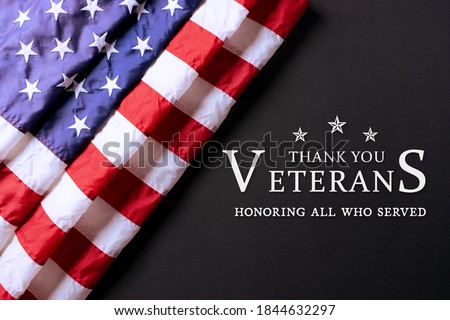 American flag on black background with text. Happy Veterans Day.