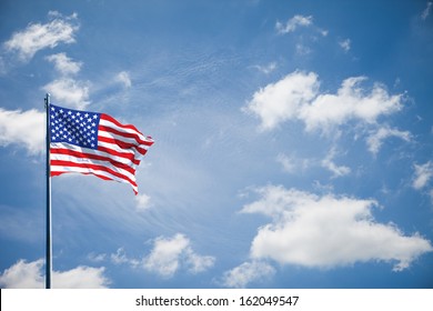 American flag on the blue sky - Shutterstock ID 162049547