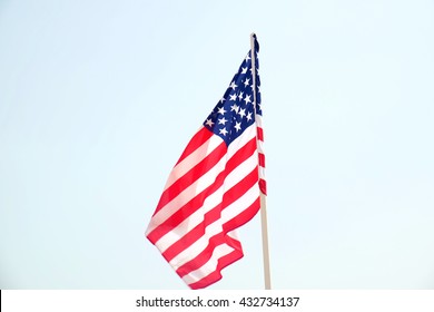 American Flag On Blue Sky Background