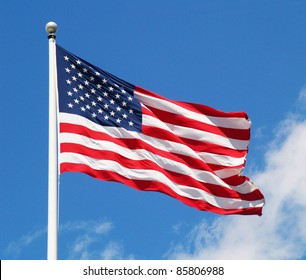 American Flag On The Blue Sky