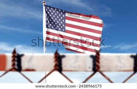American flag on cloudy sky. Flying in the sky (the foreground is intentionally blurred) [[stock_photo]] © 