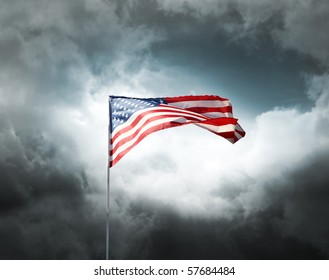 American Flag On A Dark Cloudy Dramatic Sky