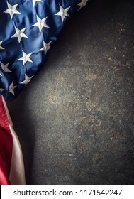 American Flag On Dark Concrete With Free Space. 4th July Veterans Or US Independence Day.