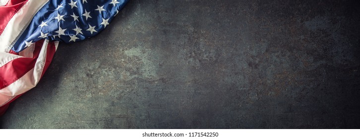 American Flag On Dark Concrete With Free Space. 4th July Veterans Or US Independence Day.