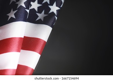 American flag on a mirror background. Symbol of the United States of America. Star-striped flag on black background. - Shutterstock ID 1667154694
