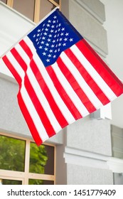 American flag on an office building. Flag of USA.
