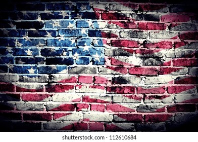 American flag on old brick wall Texture or background