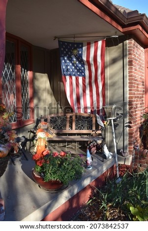 American flag on the porch of a house