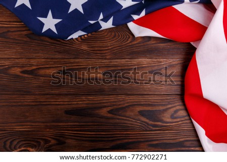 American flag on the right and top side on a wooden background
