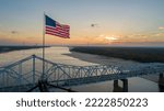 American flag on top of the old highway 80 bridge crossing over the Mississippi River at Vicksburg, MS.