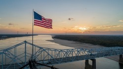 American Flag On Top Of The Old Highway 80 Bridge Crossing Over The Mississippi River At Vicksburg, MS.