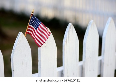American Flag on white picket fence for US holidays like Memorial or Labor Day.