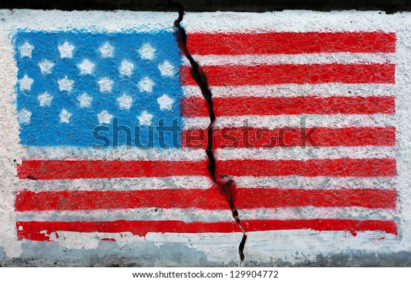 American\
flag painted on a wall cracked in the\
middle