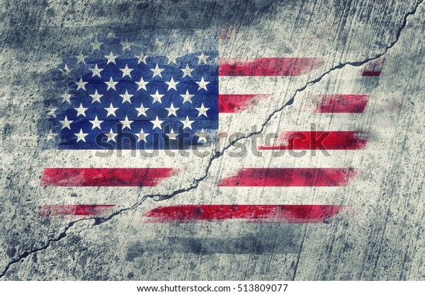 American flag painted on a wall cracked in the\
middle. Conceptual\
image.