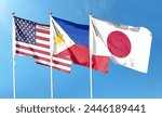 American flag and Philippine flag with Japanese flag on cloudy sky. fly in the sky