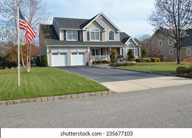 American Flag Pole Suburban McMansion Home Autumn Day Residential Neighborhood USA