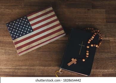 American flag with a prayer book and a rosary, vintage look and copy space - Powered by Shutterstock