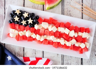 American Flag Salad With Watermelon, Blueberries And Feta Cheese. Above View Table Scene Over A White Wood Background. Fourth Of July Food Concept.