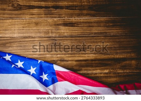 American flag section is draping over rustic wood in flat illustration showing stars stripes. Patriotism, americana, textured, heritage, rustic, flag, patriotic