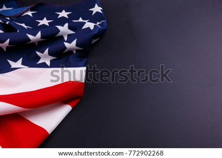 The American flag is shown not completely to the left on a gray background