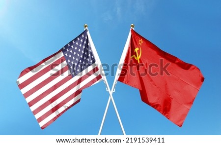 American flag and Soviet Union flag on cloudy sky. waving in the sky