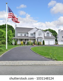 American Flag Suburban McMansion Blue Sky Clouds USA