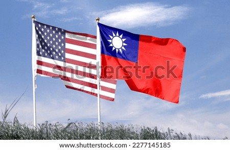 American flag with Taiwan flag on cloudy sky. waving in the sky