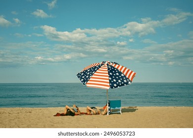 American flag umbrella on the beach, Salisbury Beach, Massachusetts - Powered by Shutterstock