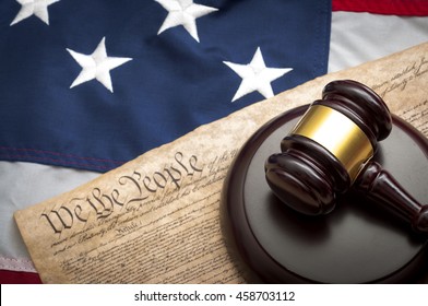 American Flag, US Constitution And A Judge's Gavel Symbolizing The American Justice System Or The Judicial Branch Of Government ( Judiciary )