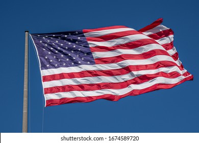 American Flag Waving In Blue Sky. Memorial Day