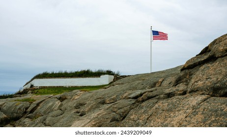 American flag waving in the memorial park in Providence, Rhodes Island at Fort Taber Park in New Bedford,  Massachusetts, USA - Powered by Shutterstock