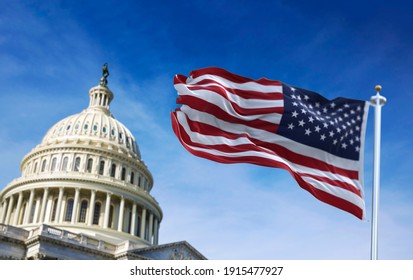 American flag waving with the US Capitol Hill in the background - Shutterstock ID 1915477927