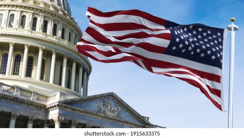 American flag waving with the US Capitol Hill in the background - Shutterstock ID 1915633375