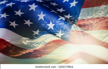 American Flag Waving In The Wind At Sunset Or Sunrise.