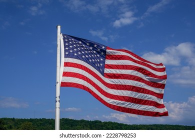 The American Flag in the wind - Shutterstock ID 2228798253