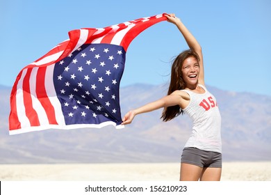 American flag - woman USA sport athlete winner cheering waving stars and stripes outdoor after in desert nature. Beautiful cheering happy young multicultural girl joyful and excited. - Powered by Shutterstock