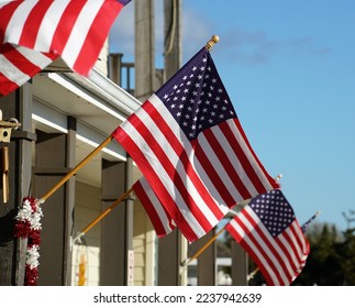 American flags flying high on a sunny winter day in Cape May New Jersey